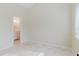 Neutral-toned bedroom featuring connecting bathroom with a vanity and open lighting at 1974 Hidden Springs Pl, Clearwater, FL 33760