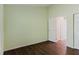 Open bedroom with wood-look floors and access to ensuite bathroom at 1974 Hidden Springs Pl, Clearwater, FL 33760