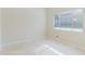 Bright bedroom featuring a large window and tile floors at 1974 Hidden Springs Pl, Clearwater, FL 33760