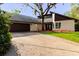 Charming single-Gathering home with mature landscaping and an attached garage at 1974 Hidden Springs Pl, Clearwater, FL 33760