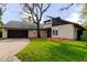 Single-Gathering home with an attached garage and mature landscaping at 1974 Hidden Springs Pl, Clearwater, FL 33760