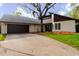 Charming single-Gathering home with an attached garage and mature landscaping at 1974 Hidden Springs Pl, Clearwater, FL 33760