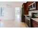 Eat-in kitchen featuring stainless steel appliances and wooden cabinets at 1974 Hidden Springs Pl, Clearwater, FL 33760