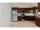 The kitchen features stainless steel appliances and plenty of cabinet space at 1974 Hidden Springs Pl, Clearwater, FL 33760