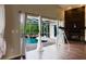 Inside view of screened pool area with waterfall feature and brick fireplace at 1974 Hidden Springs Pl, Clearwater, FL 33760