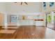 Spacious living room showcases hardwood floors, a dry bar, and a view of the patio at 1974 Hidden Springs Pl, Clearwater, FL 33760