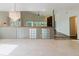 Inviting living room with a chandelier, glass block accents, and an open view to another living area with fireplace at 1974 Hidden Springs Pl, Clearwater, FL 33760