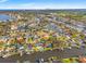 An aerial view of the property in a waterfront neighborhood with canals and pools at 2006 Tanglewood Ne Dr, St Petersburg, FL 33702