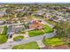 Aerial view of a home on a manicured lot in a waterfront neighborhood with canals at 2006 Tanglewood Ne Dr, St Petersburg, FL 33702