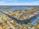 Aerial view of waterfront homes on canals with ocean view, red pin marking listing location at 2006 Tanglewood Ne Dr, St Petersburg, FL 33702