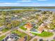 Aerial view of a waterfront property with canals, pools, and lush landscaping at 2006 Tanglewood Ne Dr, St Petersburg, FL 33702