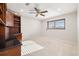 Bedroom featuring a built-in desk and shelving, ceiling fan and natural light at 2006 Tanglewood Ne Dr, St Petersburg, FL 33702