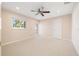 Cozy bedroom with plush carpeting, natural light and a door that leads to the outside at 2006 Tanglewood Ne Dr, St Petersburg, FL 33702