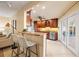 Modern kitchen with granite countertops and stainless steel appliances, connected to the living area at 2006 Tanglewood Ne Dr, St Petersburg, FL 33702