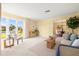 The living room offers plenty of natural light, neutral walls, and neutral carpet flooring with easy access to other rooms at 2006 Tanglewood Ne Dr, St Petersburg, FL 33702