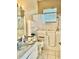 Accessible bathroom with walk-in tub and shower, featuring handrails at 23112 Emerson Way, Land O Lakes, FL 34639