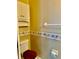 Bathroom with toilet and built-in cabinet storage at 23112 Emerson Way, Land O Lakes, FL 34639
