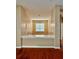 Open-concept dining room with hardwood floors and a view into the next room at 23112 Emerson Way, Land O Lakes, FL 34639