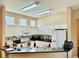 Functional kitchen with ample cabinet space and a breakfast bar at 23112 Emerson Way, Land O Lakes, FL 34639