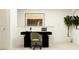 Modern home office space with sleek black desk, comfortable chair, and stylish decor for productivity at 234 Se 27Th St, Ruskin, FL 33570
