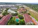 A fantastic aerial view of the condo complex and pool, surrounded by mature landscaping and beautiful trees at 2581 Countryside Blvd # 2309, Clearwater, FL 33761