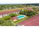 A picturesque aerial view of the community with lush trees and meticulously kept landscaping at 2581 Countryside Blvd # 2309, Clearwater, FL 33761