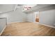 Bright bedroom featuring vaulted ceilings and light wood flooring at 2581 Countryside Blvd # 2309, Clearwater, FL 33761