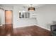 Dining room showing granite counter pass-through to kitchen with stainless appliances at 2581 Countryside Blvd # 2309, Clearwater, FL 33761