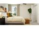 Bedroom featuring a plush bed, neutral walls, and natural light at 2724 Bryce Ravine Ave, Plant City, FL 33563