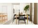Bright dining room featuring black chairs, a plant, and a rug at 2724 Bryce Ravine Ave, Plant City, FL 33563