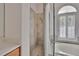 Bathroom featuring a walk in shower, soaking tub, and neutral tile work at 27440 Cedar Park Ct, Wesley Chapel, FL 33544
