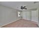 Cozy bedroom with carpet flooring, large closet, and bright window at 27440 Cedar Park Ct, Wesley Chapel, FL 33544