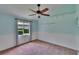 Bright bedroom with unique blue accent wall, and ceiling fan at 27440 Cedar Park Ct, Wesley Chapel, FL 33544