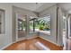 Eat in area with views of the lanai, patio, and pool through large windows with white trim at 27440 Cedar Park Ct, Wesley Chapel, FL 33544