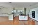 Spacious kitchen features an island, stainless appliances, granite countertops, and white cabinetry at 27440 Cedar Park Ct, Wesley Chapel, FL 33544