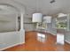 Open living room showcases hardwood floors, stylish lighting, and view of the backyard at 27440 Cedar Park Ct, Wesley Chapel, FL 33544