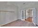 Home office space with neutral walls, carpet flooring, and a white french door with blinds at 27440 Cedar Park Ct, Wesley Chapel, FL 33544
