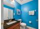 Vibrant powder room with a granite vanity, stylish fixtures, and a fresh, modern aesthetic at 3000 Naughton Way, Tarpon Springs, FL 34688