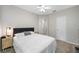 Neutral bedroom with a ceiling fan, a window and soft carpet flooring at 3000 Naughton Way, Tarpon Springs, FL 34688