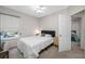Cozy bedroom with a ceiling fan and a view to the yard through a window at 3000 Naughton Way, Tarpon Springs, FL 34688