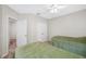 Spacious bedroom showcasing soft carpet flooring and a ceiling fan at 3000 Naughton Way, Tarpon Springs, FL 34688