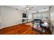 Spacious bonus room featuring hardwood floors and plenty of space for different activities at 3000 Naughton Way, Tarpon Springs, FL 34688