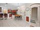 Inviting dining area with views into the kitchen and bar, creating a warm and welcoming atmosphere at 3000 Naughton Way, Tarpon Springs, FL 34688
