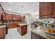 Spacious kitchen with granite countertops, stainless steel appliances, and ample cabinet space at 3000 Naughton Way, Tarpon Springs, FL 34688