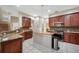 Well-equipped kitchen with a center island, stainless steel appliances, and ample counter space at 3000 Naughton Way, Tarpon Springs, FL 34688