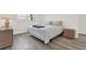 Sunlit bedroom with neutral walls and flooring, featuring a queen size bed and dresser at 3146 37Th S Ln # A, St Petersburg, FL 33711