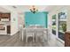 Dining room with updated flooring, colorful accent wall, and sliders leading to outdoor living at 3146 37Th S Ln # A, St Petersburg, FL 33711
