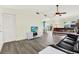 Open-concept living room showcasing updated flooring, neutral walls, and a ceiling fan for comfortable living at 3146 37Th S Ln # A, St Petersburg, FL 33711