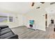 Bright living room featuring new floors, a ceiling fan and convenient access to other rooms at 3146 37Th S Ln # A, St Petersburg, FL 33711