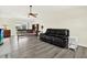 Bright living room featuring new flooring, a ceiling fan, neutral paint, and access to a patio at 3146 37Th S Ln # A, St Petersburg, FL 33711